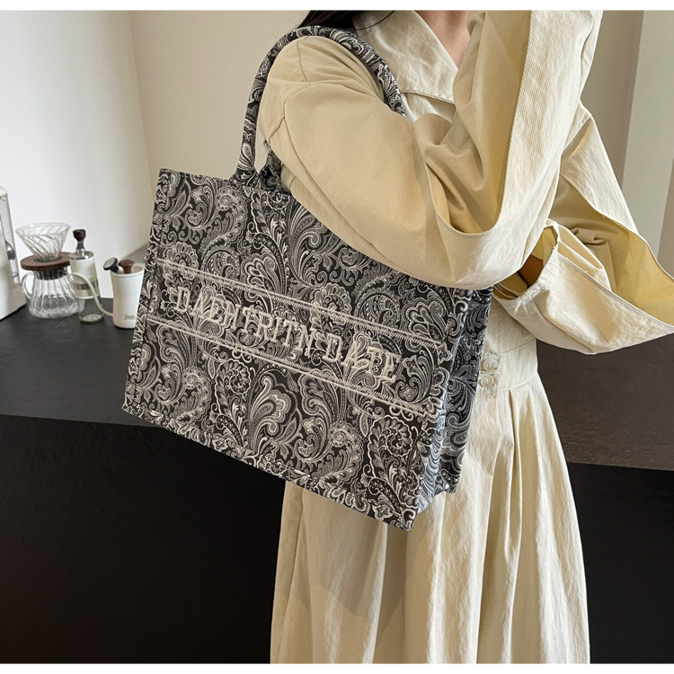 2025 Free shipping designer bag Shoulder Bags Fashionable commuting large capacity new single Stitched bag tote bag