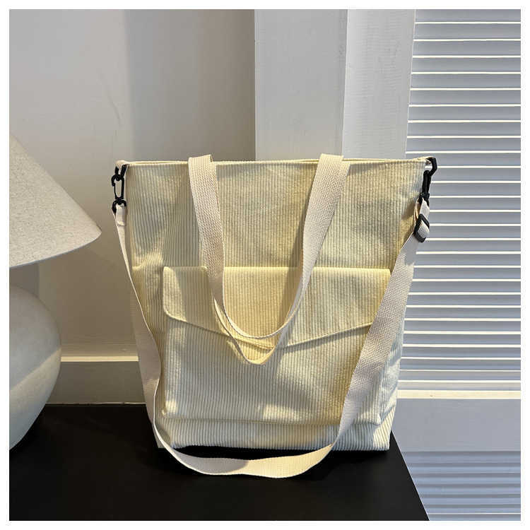 New Korean version of minimalist 2025 casual large capacity solid color fashionable striped fabric tote handbag, single shoulder crossbody women'