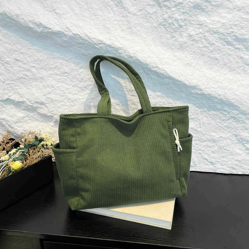 Casual Western style pendant with large capacity and simple 2024 solid color new trend, simple striped velvet hand-held shoulder tote bag for women 24