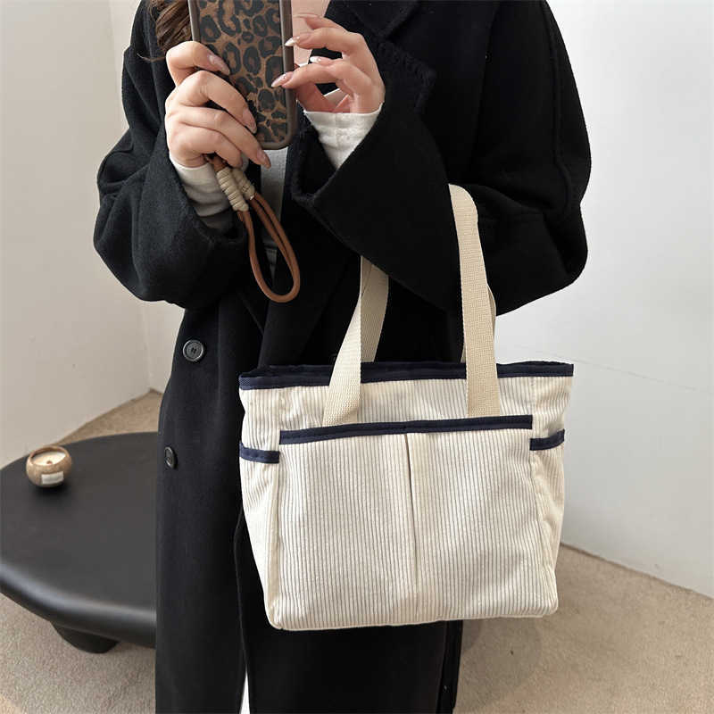 Corduroy solid color large capacity 2025 new early spring leisure trend flu personality commuting tote armpit shoulder bag 241231