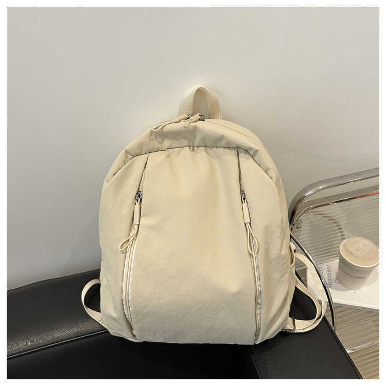 College style lightweight middle and high school students commuting to class trendy Western style solid color large capacity travel backpack for women