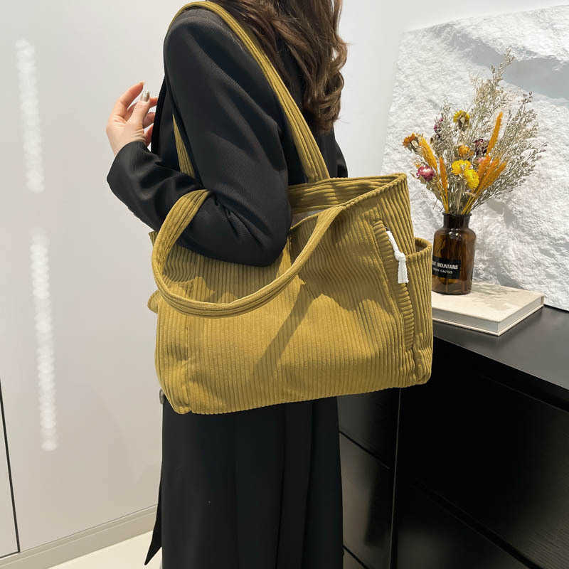 Casual Western style pendant with large capacity and simple 2024 solid color new trend, simple striped velvet hand-held shoulder tote bag for women 24