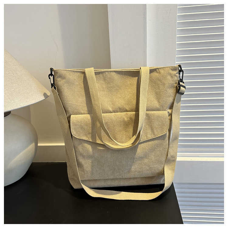 New Korean version of minimalist 2025 casual large capacity solid color fashionable striped fabric tote handbag, single shoulder crossbody women'