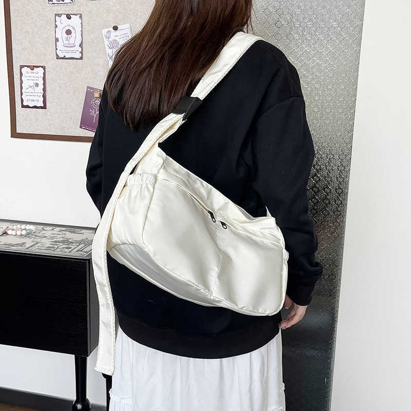 Large capacity single shoulder tote casual waterproof and stylish simple nylon fabric solid color lightweight sports dumpling tote women's bag 24