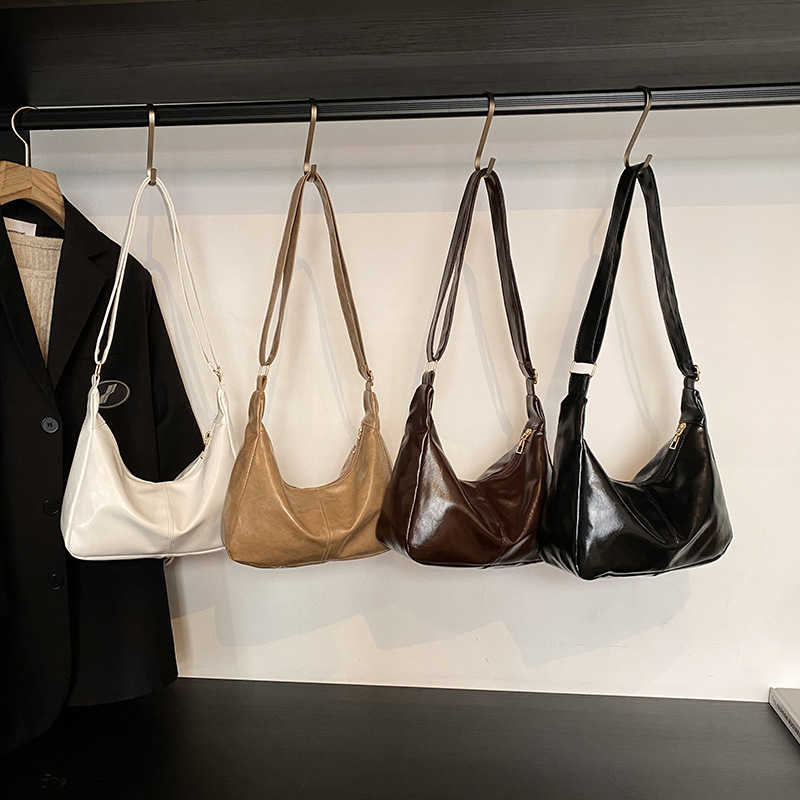 Solid color large capacity 2025 new commuting Korean version fashionable simple casual hand-held shoulder tote bag for women 241231