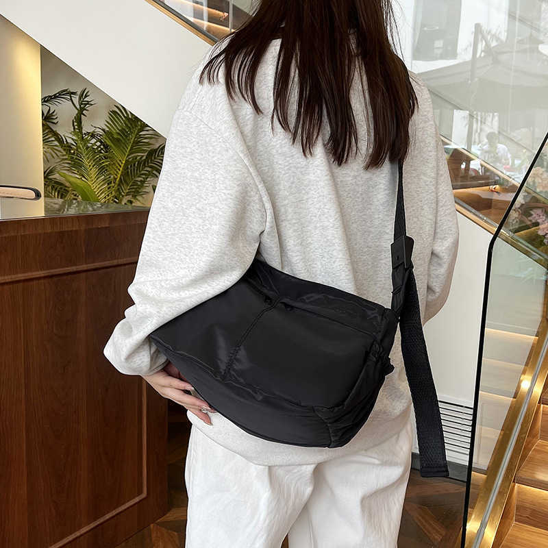 Large capacity single shoulder tote casual waterproof and stylish simple nylon fabric solid color lightweight sports dumpling tote women's bag 24