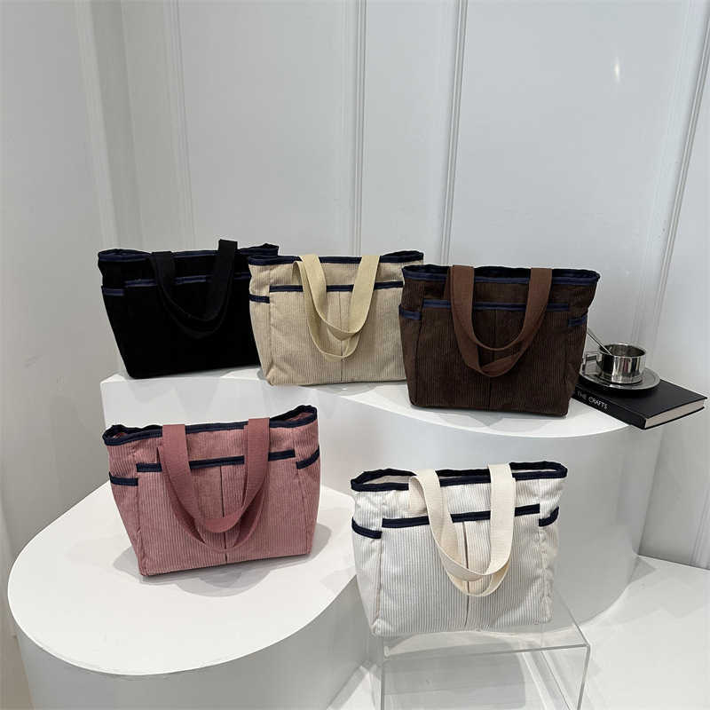 Corduroy solid color large capacity 2025 new early spring leisure trend flu personality commuting tote armpit shoulder bag 241231