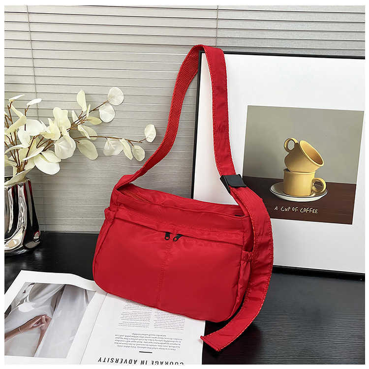 Large capacity single shoulder tote casual waterproof and stylish simple nylon fabric solid color lightweight sports dumpling tote women's bag 24