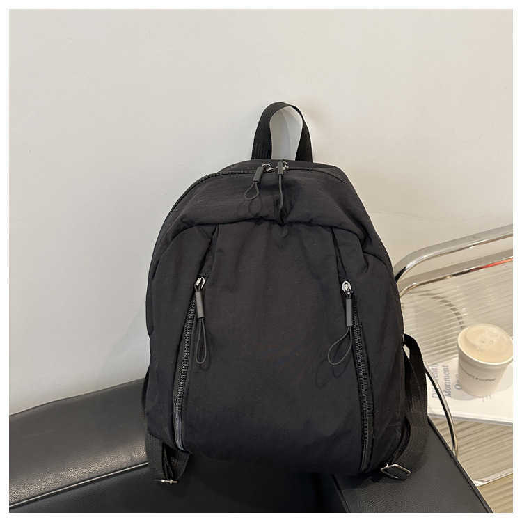 College style lightweight middle and high school students commuting to class trendy Western style solid color large capacity travel backpack for women