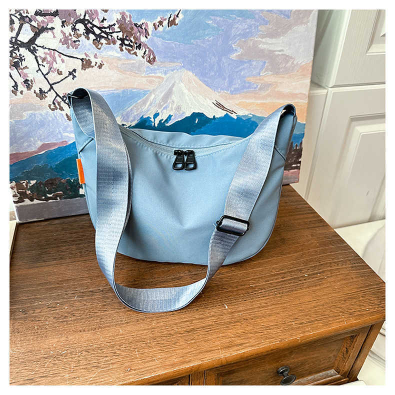 New large capacity simple and stylish 2024 nylon casual solid color contrasting dumpling tote single shoulder diagonal cross bag for women