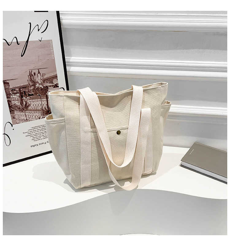 Large capacity canvas fashionable commuting to work and going out solid color leisure art tote, single shoulder armpit bag, women's bag