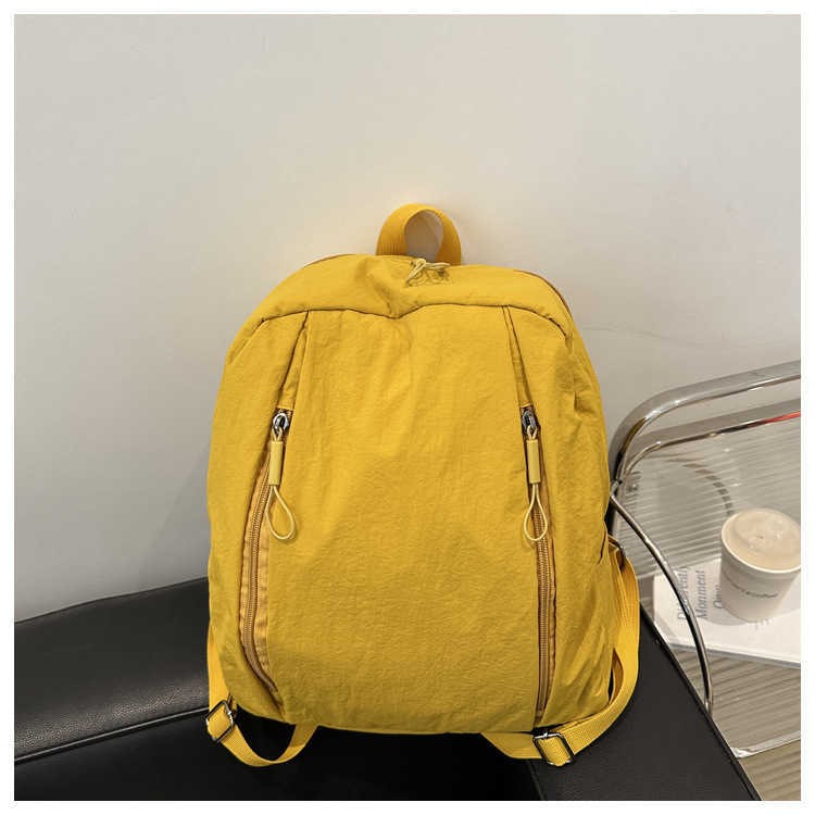 College style lightweight middle and high school students commuting to class trendy Western style solid color large capacity travel backpack for women