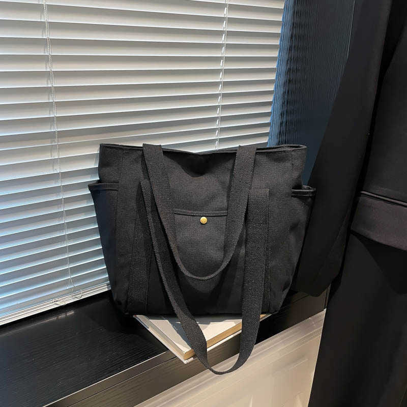 Large capacity canvas fashionable commuting to work and going out solid color leisure art tote, single shoulder armpit bag, women's bag