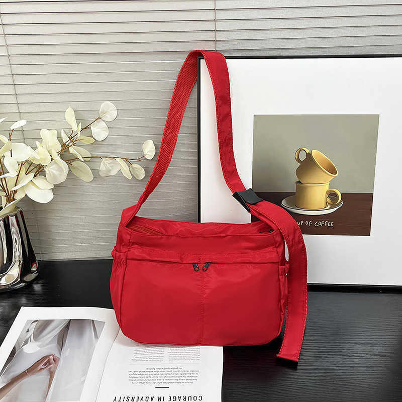 Large capacity single shoulder tote casual waterproof and stylish simple nylon fabric solid color lightweight sports dumpling tote women's bag 24