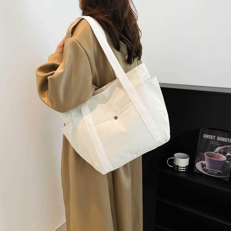 Large capacity canvas fashionable commuting to work and going out solid color leisure art tote, single shoulder armpit bag, women's bag