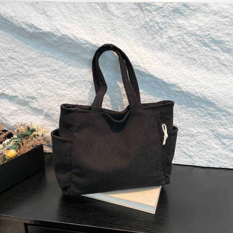 Casual Western style pendant with large capacity and simple 2024 solid color new trend, simple striped velvet hand-held shoulder tote bag for women 24