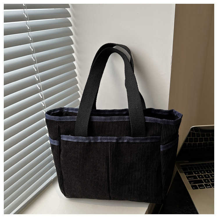 Corduroy solid color large capacity 2025 new early spring leisure trend flu personality commuting tote armpit shoulder bag 241231