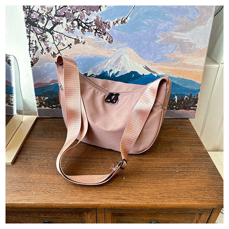 New large capacity simple and stylish 2024 nylon casual solid color contrasting dumpling tote single shoulder diagonal cross bag for women