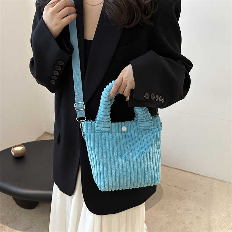 2024 contrasting new corduroy style, simple and large capacity casual single shoulder crossbody handbag, water bucket bag for women 241231