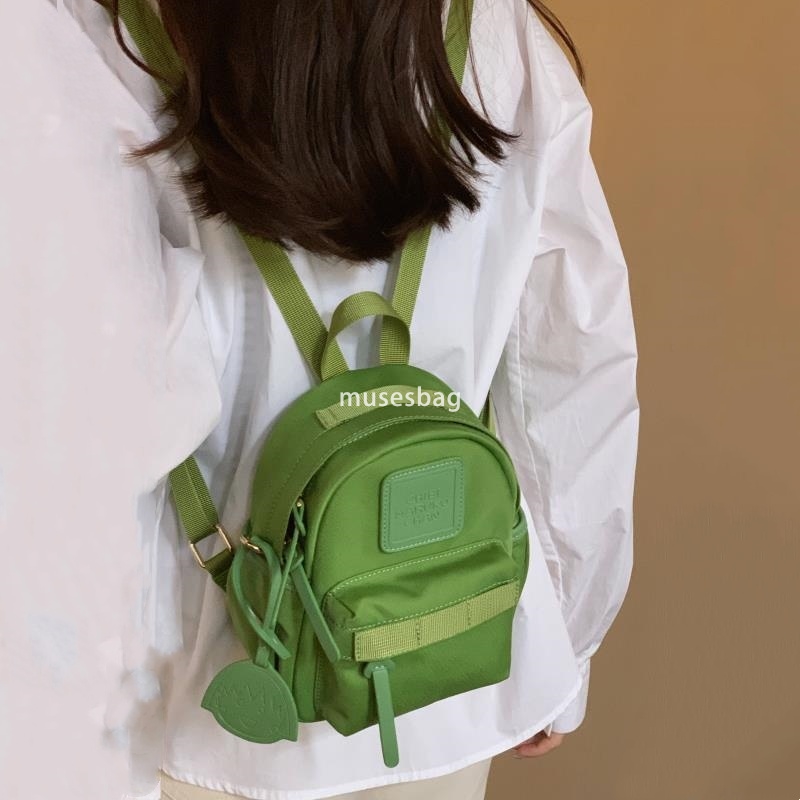 Japanese women's temperament niche mini compact practical backpack solid color bright color macaron green small backpack for travel and shopping 