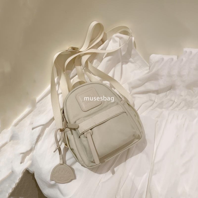 Japanese women's temperament niche mini compact practical backpack solid color bright color macaron green small backpack for travel and shopping 