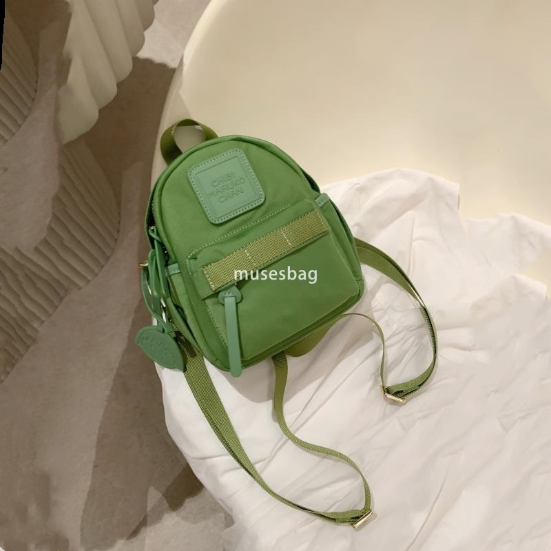 Japanese women's temperament niche mini compact practical backpack solid color bright color macaron green small backpack for travel and shopping 
