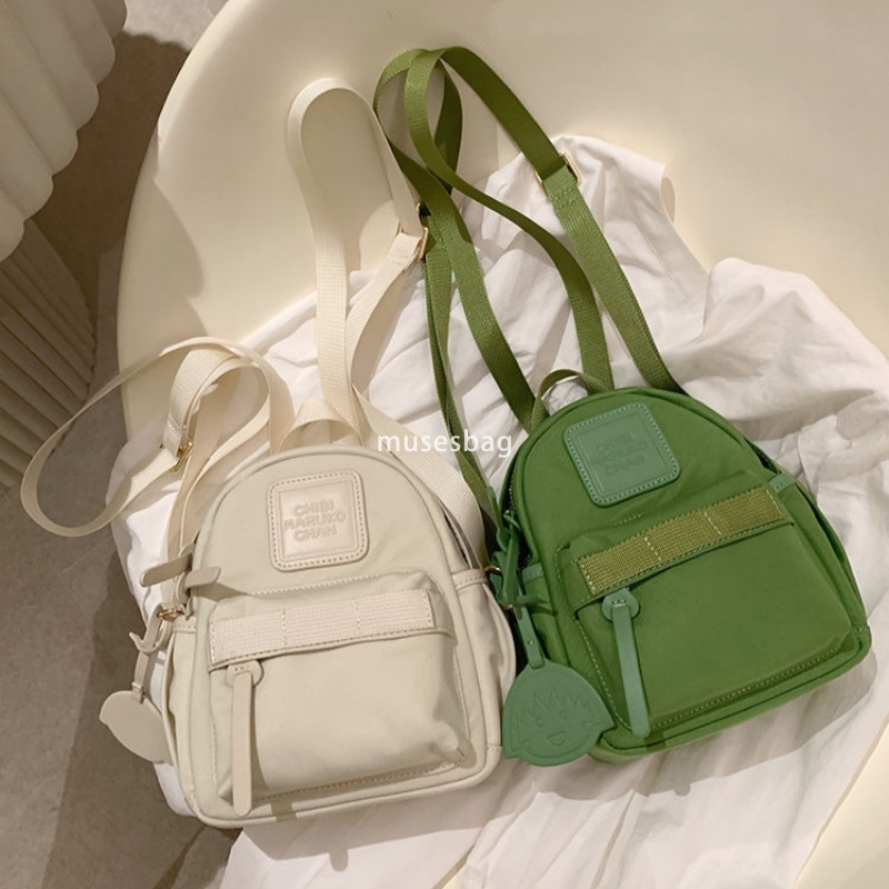 Japanese women's temperament niche mini compact practical backpack solid color bright color macaron green small backpack for travel and shopping 