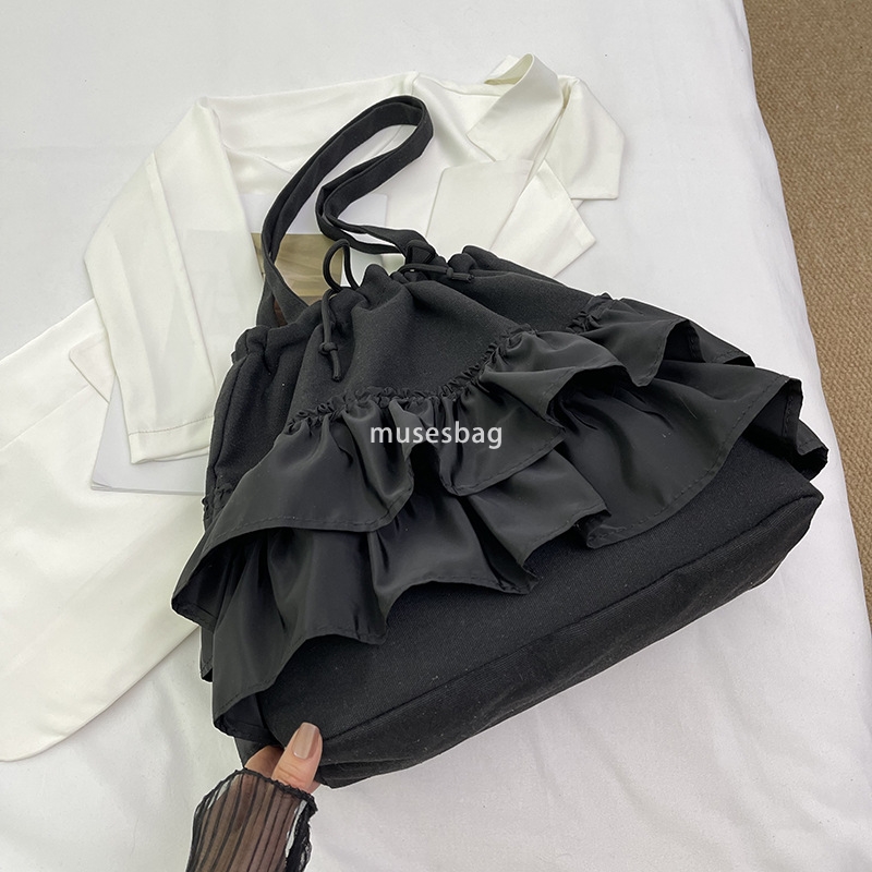 High quality niche design simple and casual bucket bag women's summer new large capacity lace canvas bag commuting bag