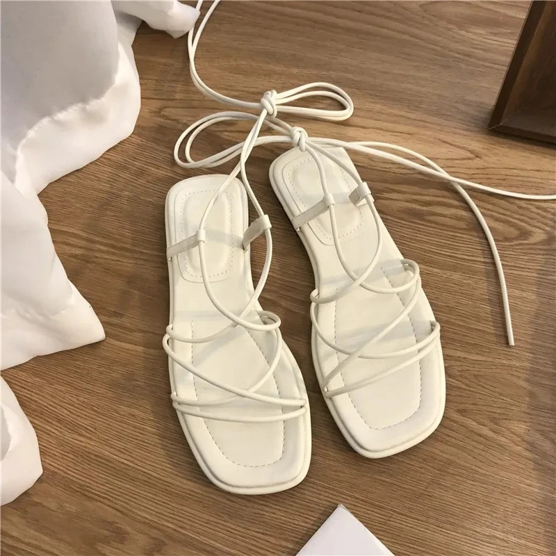 Sandals Womens Summer 2024 Beach Fashion Sexy Flat Casual Cross Tie Open Toe Fairy Style Narrow Band Shoes Black Roman Sandals 240712