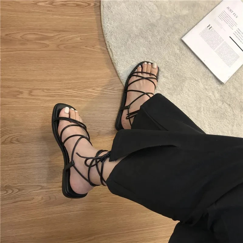 Sandals Womens Summer 2024 Beach Fashion Sexy Flat Casual Cross Tie Open Toe Fairy Style Narrow Band Shoes Black Roman Sandals 240712