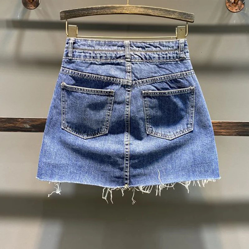 The half length skirt Korean high waisted buttocks wrapped short skirt pants for women summer with a hole shaped denim skirt 240709