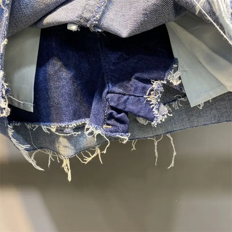 The half length skirt Korean high waisted buttocks wrapped short skirt pants for women summer with a hole shaped denim skirt 240709