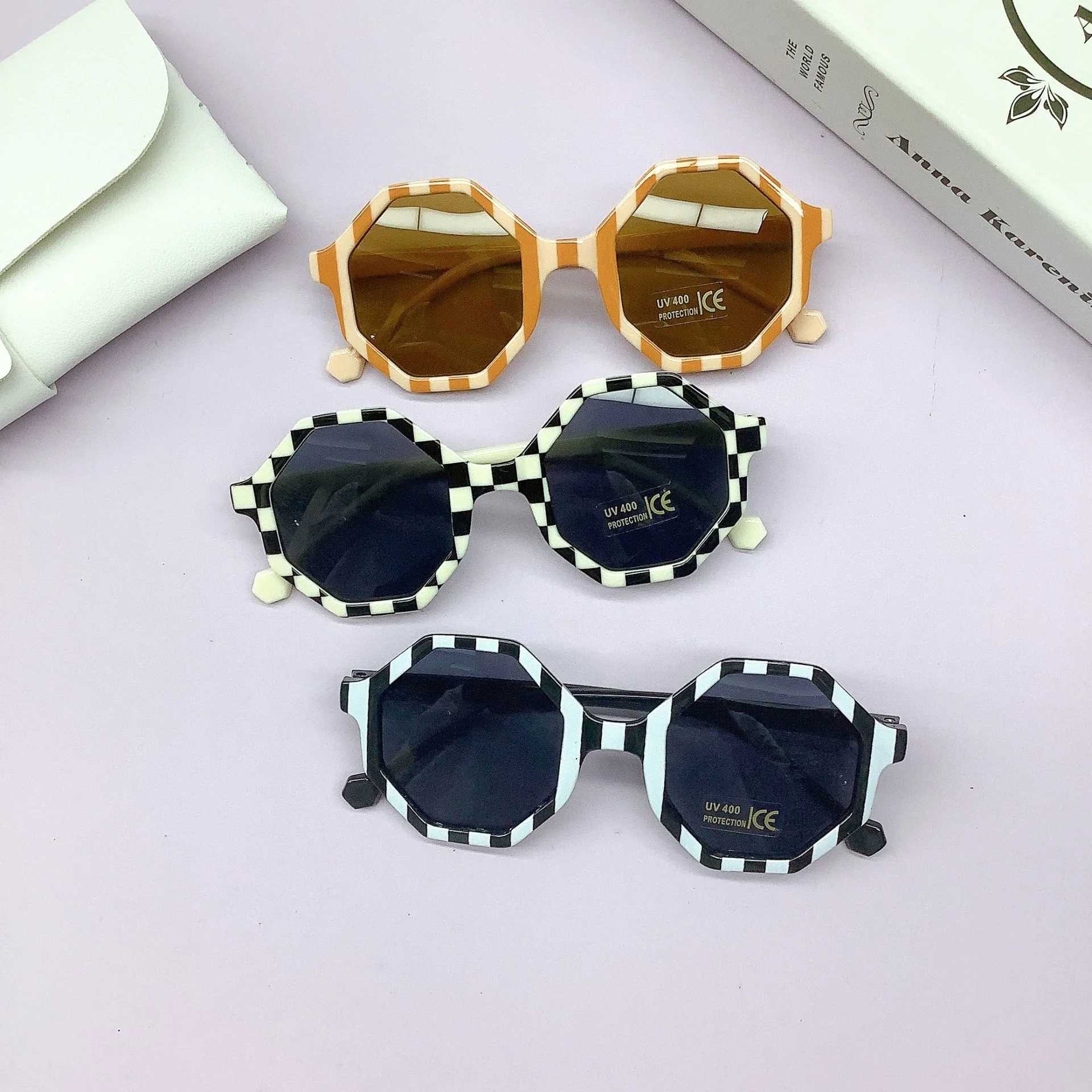 Sunglasses Fashionable PC frame childrens sunglasses wrapped with lovely concave shape anti-UV childrens sunglasses tide