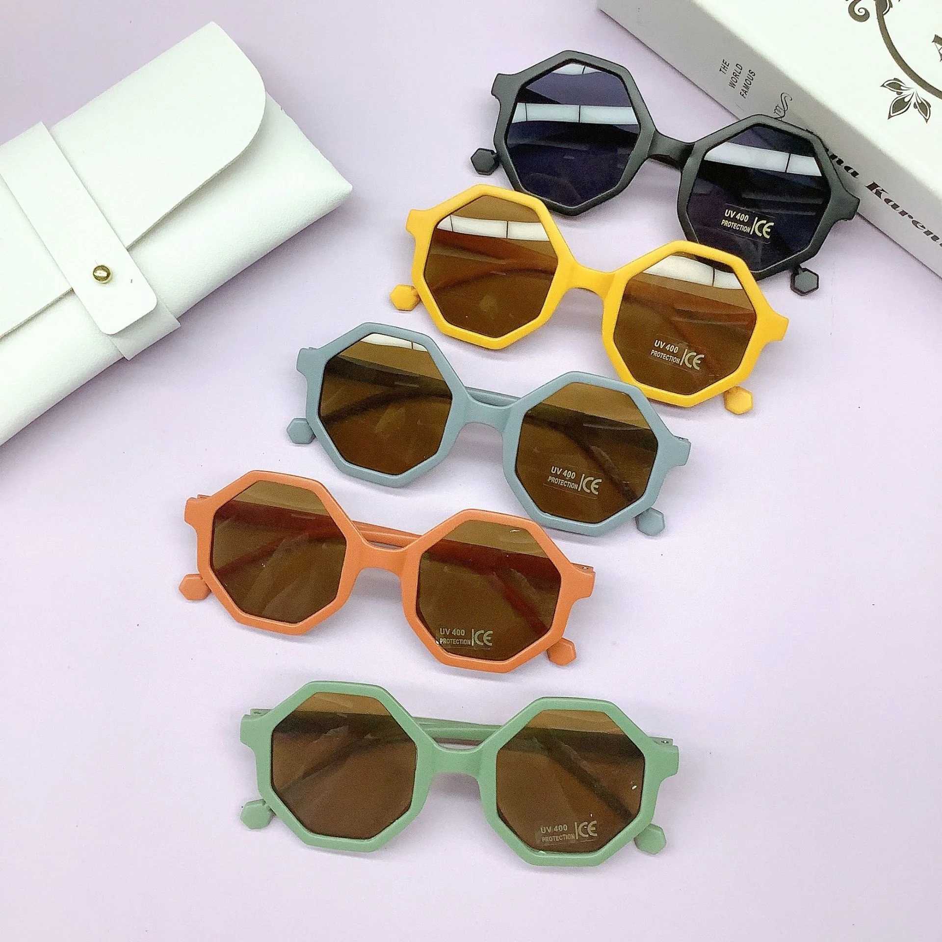 Sunglasses Fashionable PC frame childrens sunglasses wrapped with lovely concave shape anti-UV childrens sunglasses tide