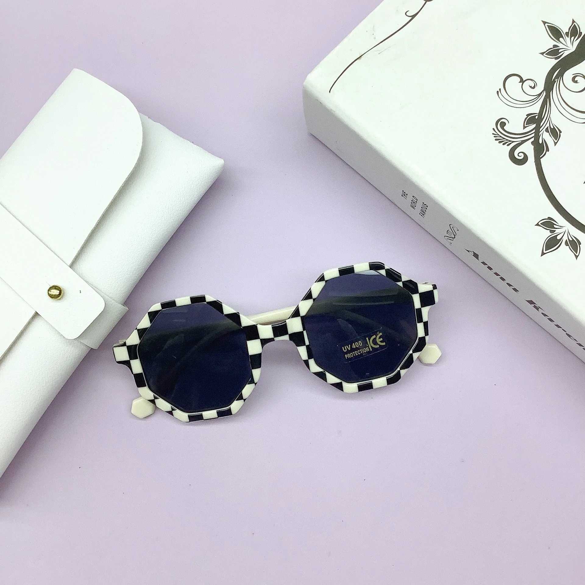 Sunglasses Fashionable PC frame childrens sunglasses wrapped with lovely concave shape anti-UV childrens sunglasses tide