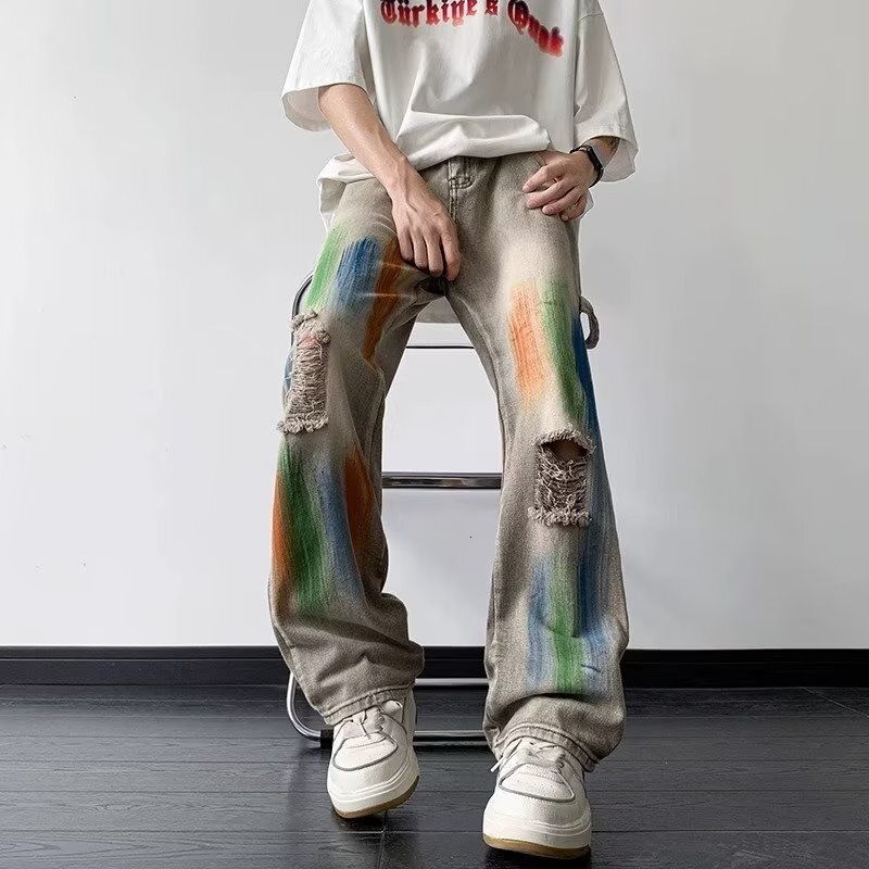 American style yellow mud dyed ripped jeans for men women, splashed ink tie dye wide leg work pants, unisex, wearing outfit to show off slim and high 