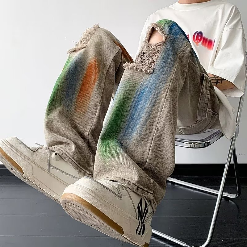 American style yellow mud dyed ripped jeans for men women, splashed ink tie dye wide leg work pants, unisex, wearing outfit to show off slim and high 