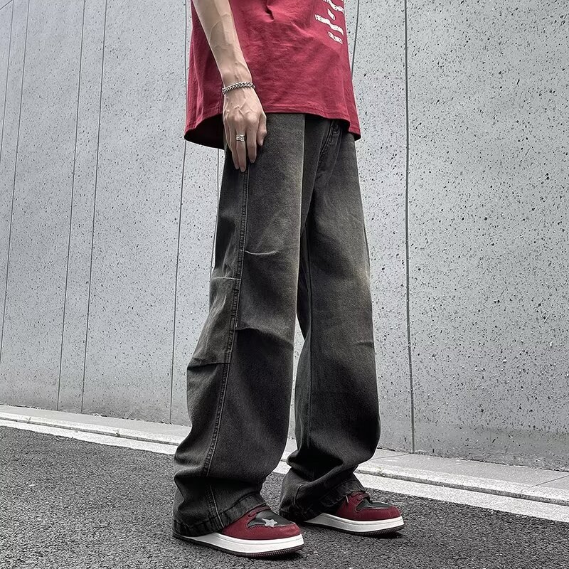 American style high street stacked vintage washed denim jeans for men in spring fashion, with a hanging sensation and wide leg pants that can be dragg