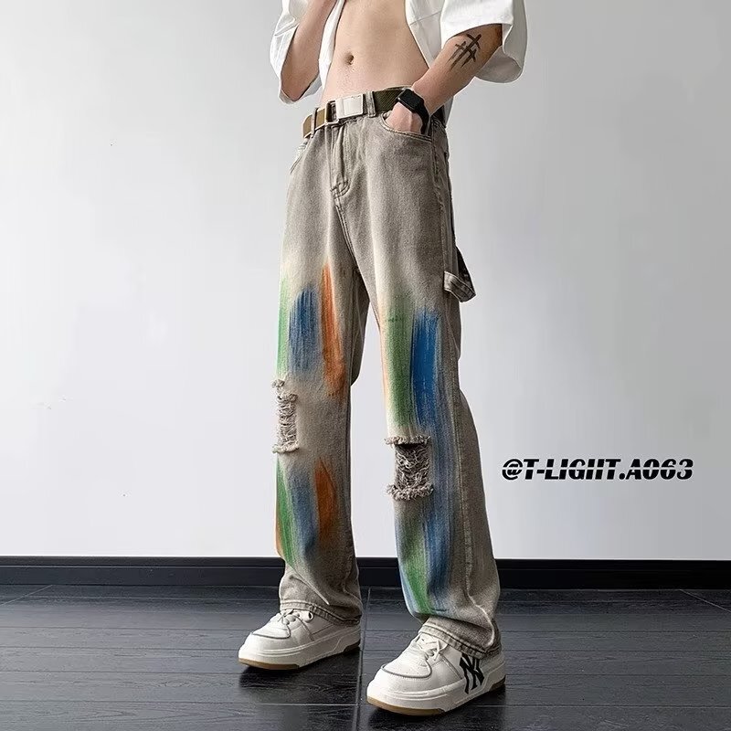American style yellow mud dyed ripped jeans for men women, splashed ink tie dye wide leg work pants, unisex, wearing outfit to show off slim and high 
