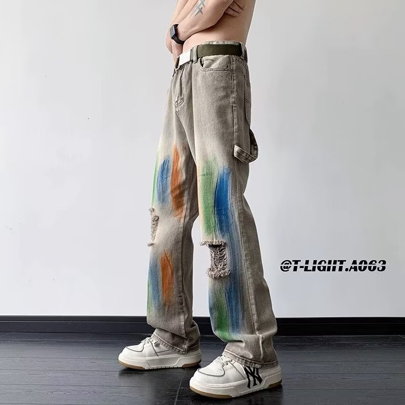American style yellow mud dyed ripped jeans for men women, splashed ink tie dye wide leg work pants, unisex, wearing outfit to show off slim and high 