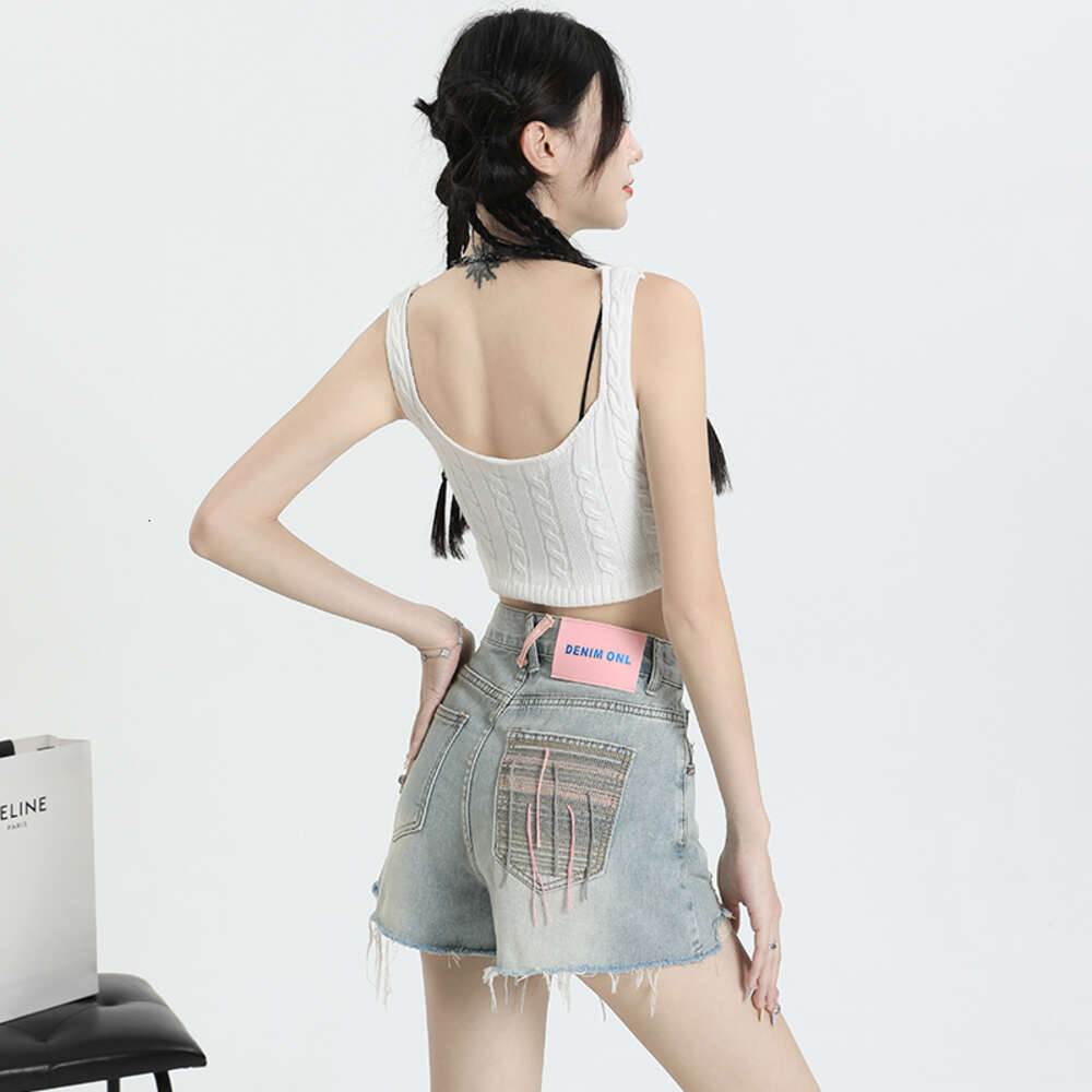 Broken hole denim shorts for women 2023 summer new style loose American high street slimming versatile wide leg A-line hot pants
