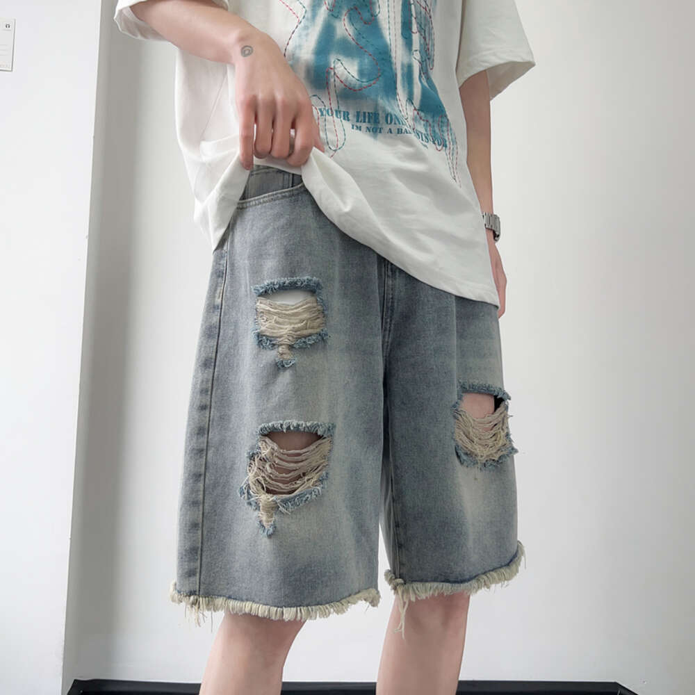 Ripped denim shorts with rough edges, men's summer trendy casual five quarter pants, washed wide leg mid length pants