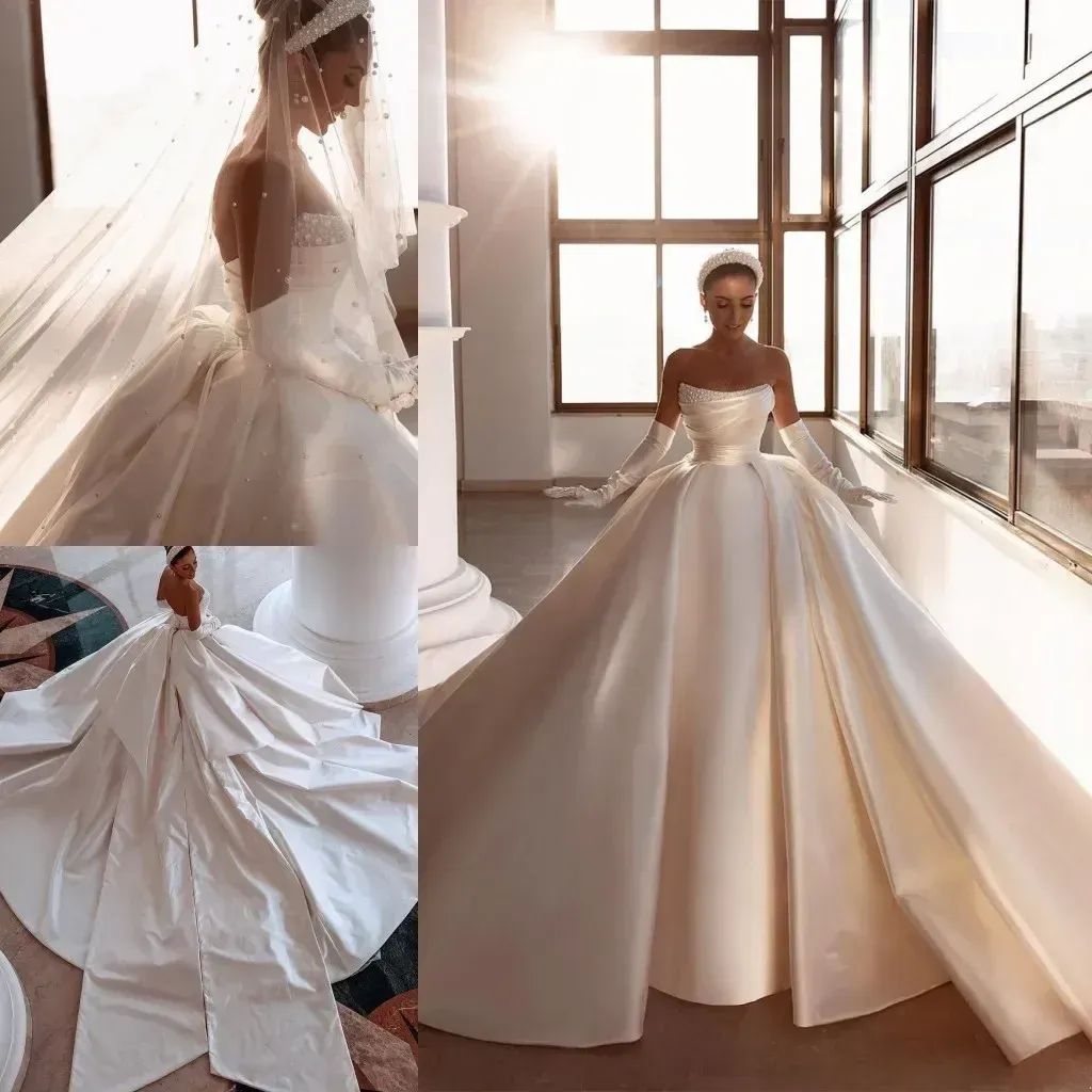 Royal Ivory Satin Dubai Arabic Wedding Dresses Sexy Beads Strapless Backless Ruched Long Train Bridal Gowns With Big Bow Robes 2024 BC14905 Custom Mad