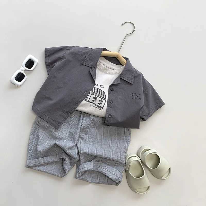 2024 Summer New Childrens Short sleeved Collar Shirt Cotton Boys and Girls Thin Casual Top Letter Printing Childrens Loose ClothesW240729
