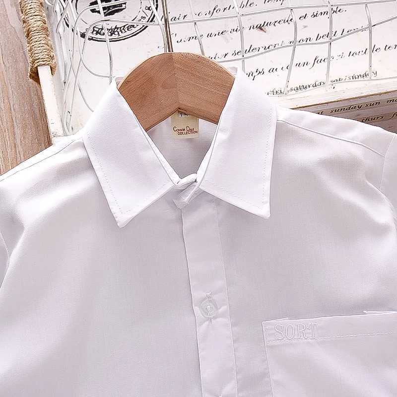 Flip collar pocket design baby shirt summer new boy baby short sleeved solid color boy childrens clothingW240729
