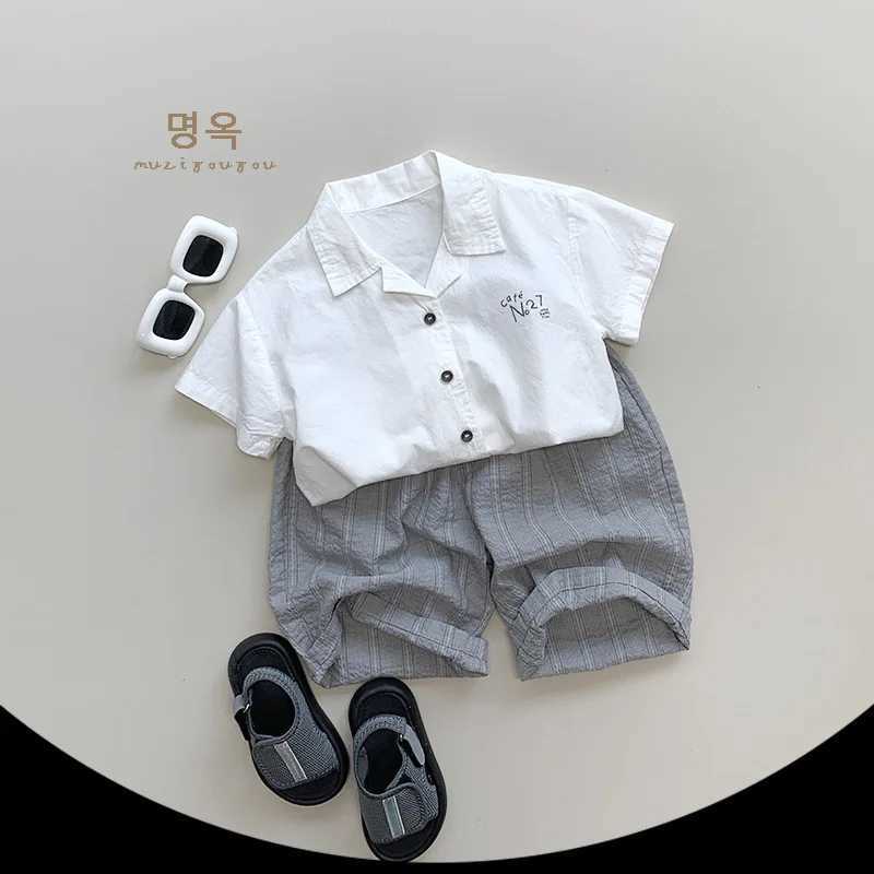 2024 Summer New Childrens Short sleeved Collar Shirt Cotton Boys and Girls Thin Casual Top Letter Printing Childrens Loose ClothesW240729