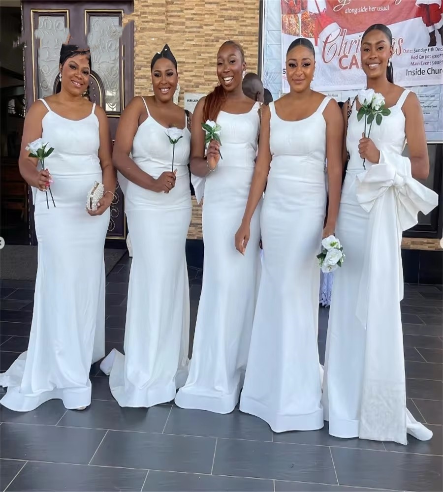 2025 White Country Memaid Bridesmaid Dresses Spaghetti Straps Soft Satin Maid Of Honor African Wedding Guest Dress With Bow Backless