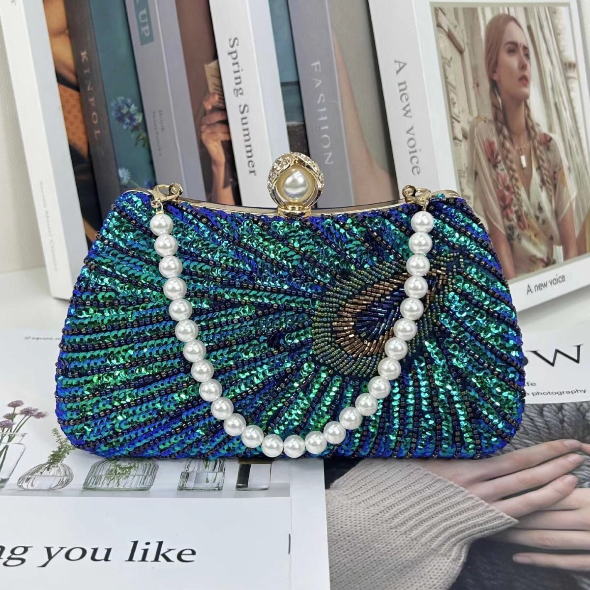 New designer Dingzhu Peacock Feather Big Pearl Diamond Banquet Skirt Multi functional Large Capacity Cross Shoulder Women's Bag