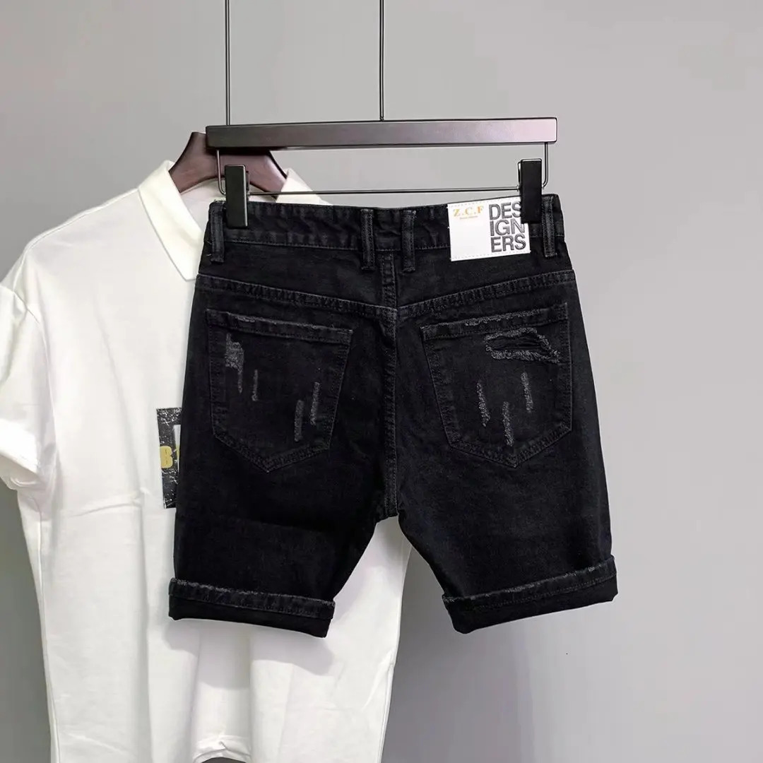 2025 Designer Ripped Patched Shorts Korean Style Men's Slim Fit Black Jeans Design Sense Loose Teenage Five Quarter Pants Summer Fashion Casual P