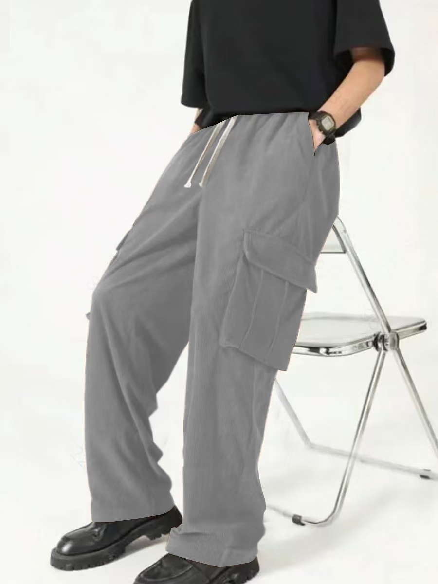 Men's new hot European and American fashion and leisure sports corduroy multi-bag overalls trousers.